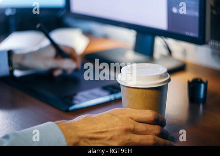 Desktop side view. Computer Graphics Tablet Diary Cup of coffee Hand. Concept for website banner, mockup, background, presentation and marketing mater Stock Photo
