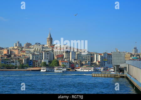 Istanbul, Turkey - Galata Bridge. A view from the historic bridge where amateur fishermen always fishing, along with pedestrian and car crossing. Stock Photo