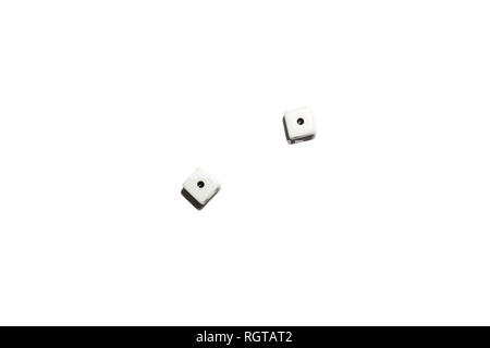 Isolated dice on a white isolated background cast a shadow, the cubes with black dots on which an equal number one fell, denoting a draw in a bet. Stock Photo