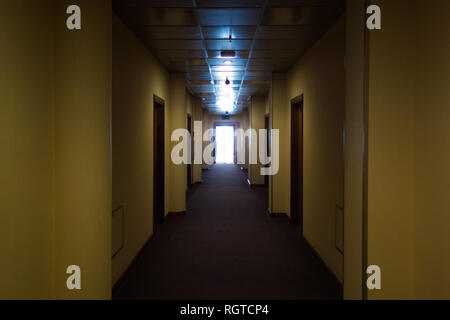 Empty hotel interior, light at the end corridor. The end concept Stock Photo