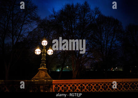 Gloucester Gate Bridge elaborate bronze candelabra shot at night Gloucester gate victorian street lamps regents park royal parks camden Stock Photo