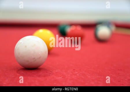 Red Billiards pool table with balls close-up Stock Photo