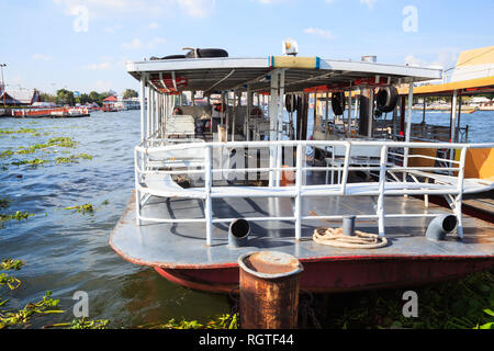 Ferryboat anchored at harbor waiting to transport passengers across river. Marine Transportation, Commercial Vessel, Ferry Trip, Travel, Tourism, Rive Stock Photo