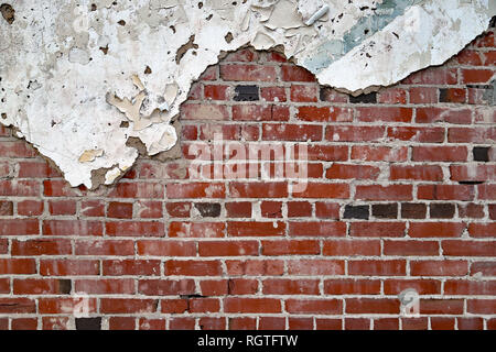 Old Vintage painted Brick and mortar wall with plaster and pealing paint, background texture Stock Photo