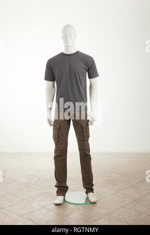 Mannequins with grey shirt, isolated on white Stock Photo