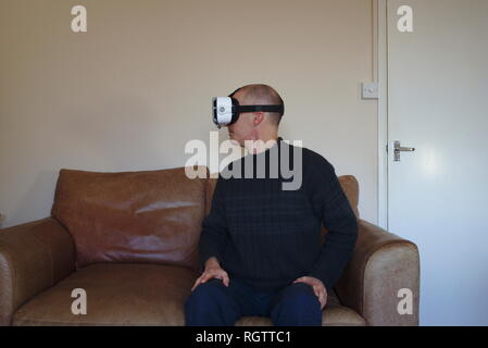 Man wearing virtual reality headset Stock Photo
