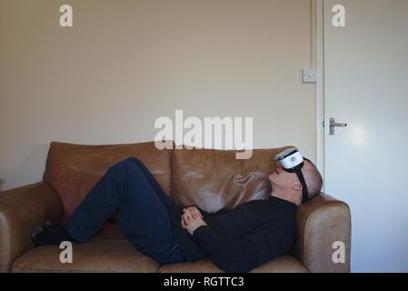 Man wearing virtual reality headset Stock Photo