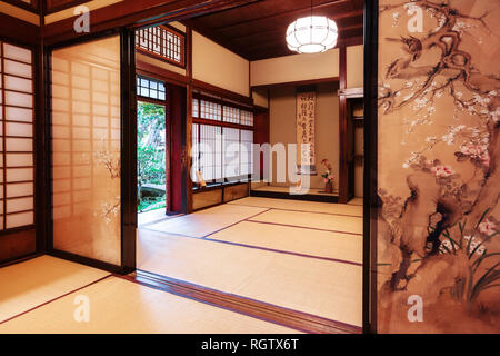 Kanazawa, Japan - November 15, 2018: Tea room with painted screen doors in Nomura Samurai House in Kanazawa. This house is the only samurai house open Stock Photo