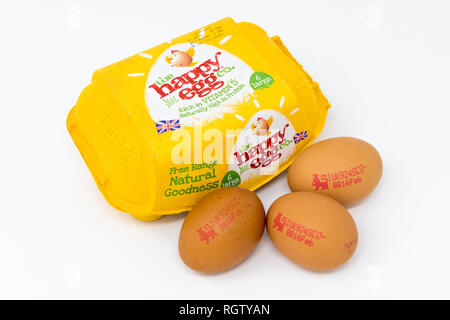 The Happy Egg co. egg carton with eggs stamped with the British Lion quality logo. Stock Photo