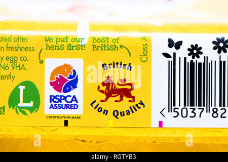 The Happy Egg co. egg carton stamped with the British Lion quality and the RSPCA assured logo. Stock Photo