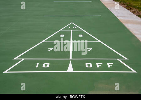 white and green painted shuffleboard game sign on pavement Stock Photo
