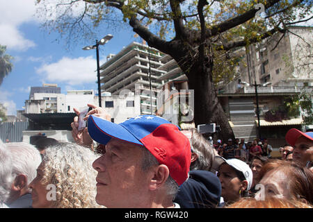 Venezuelan people protesting in Caracas against Maduro and supporting interim president Juan Guaidó Stock Photo