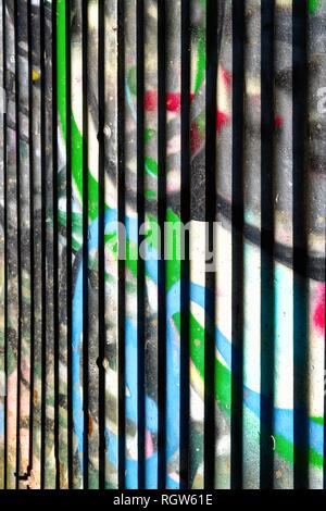 Abstract vertical pattern painted in multi coloured spray paint Stock Photo