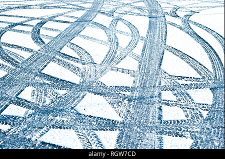 pattern of tires tracks in the snow Stock Photo