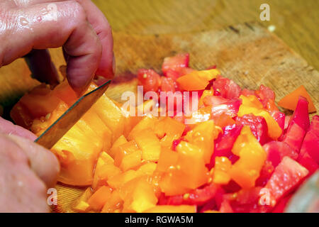 Cuts vegetables-yellow and red tomatoes on a cutting Board Stock Photo