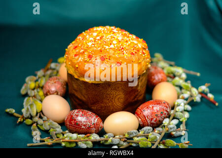 Easter eggs and bread on a dark background with willow branches background. 2019 Stock Photo
