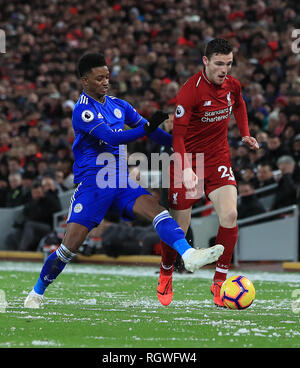Leicester City's Demarai Gray and Liverpool's Andrew Robertson battle for the ball during the Premier League match at Anfield, Liverpool. Stock Photo