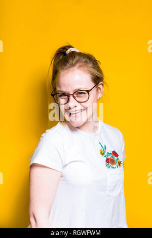 Blonde Woman posing in wall Stock Photo