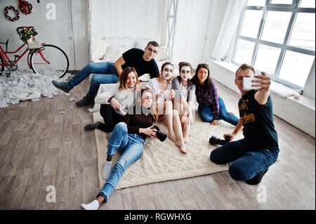 Group of people making selfie. Team photographer, designers and models stuff on photosession, master class of proffesionals. Stock Photo