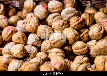Walnuts in shells background Stock Photo