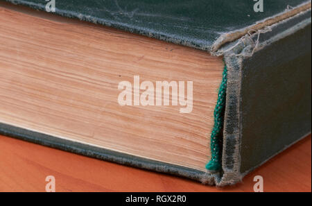 Ancient old aged green book macro detail Stock Photo