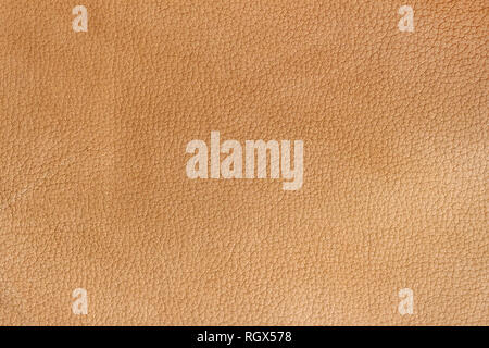 Texture of genuine leather close-up, beyge brown color print. For your background, backdrop, copy space Stock Photo