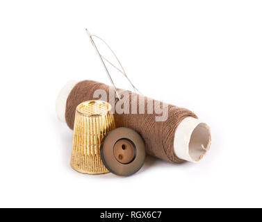 thread, needle, button and thimble on isolate white background Stock Photo