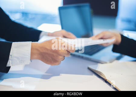 Businessmen and Businesswomen discussing documents for job interview concept Stock Photo