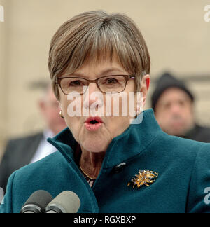 Topeka, Kansas, USA, January 14, 2019 Democrat Governor Laura Kelly delivers her inaugural speech is front of the steps of the Kansas State Capitol building Credit: Mark Reinstein/MediaPunch Stock Photo