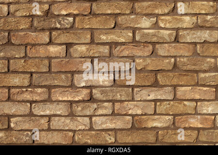 wall of brown brick hand-molded texture background Stock Photo