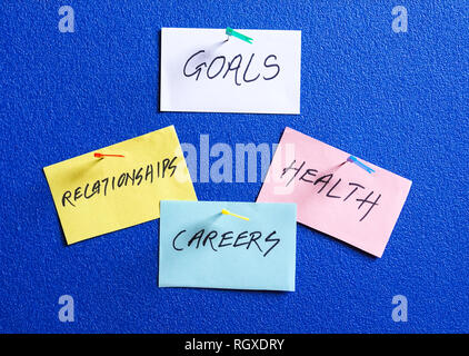 Goals in careers, health and relationships written on colored papers Stock Photo