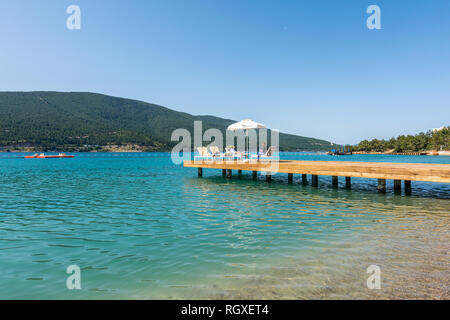 Yalikavak/Bodrum, Turkey - May 02, 2016: People chilling on the pier Stock Photo