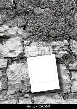 Blank square instant photo frame on old weathered stone wall background Stock Photo