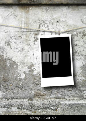 Blank rectangular photo frame against weathered concrete wall background Stock Photo