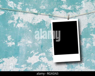 Blank rectangular photo frame against aqua and white scratched concrete wall background Stock Photo