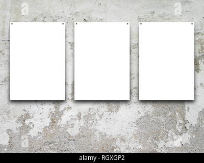 Three nailed blank frames on scratched concrete wall background Stock Photo