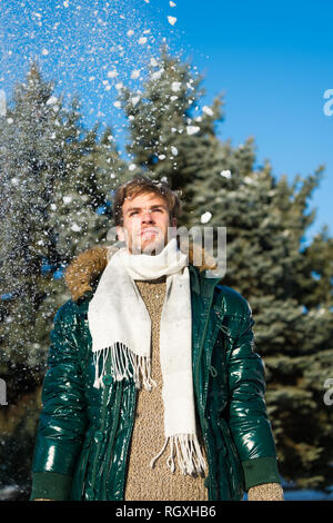 Vacation and traveling. Snowy weather. Trendy winter coat. Man. It is cold outside. Forest in snow. Fresh air. Happy man on winter holiday. Winter fashion. Warm clothes. Cheerful winter boy Stock Phot...