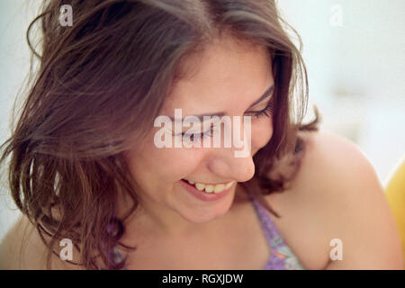 MERIDA, YUC/MEXICO - JUNE 1ST, 2015: Negative color film Kodak Pro Image, portrait of a young woman outdoor with her eyes closed, laughing Stock Photo