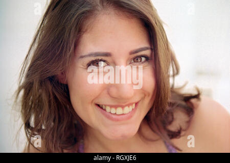 MERIDA, YUC/MEXICO - JUNE 1ST, 2015: Negative color film Kodak Pro Image, portrait of a young woman outdoor, smiling Stock Photo