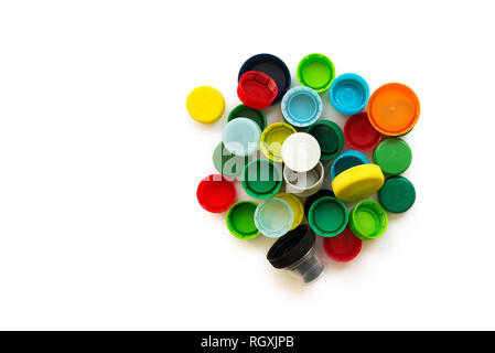 Various colorful plastic screw caps isolated on the white background. Conception of plastic processing for ecology or charity. Stock Photo