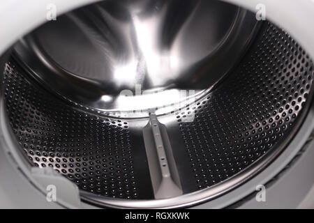 The inside of a washing machine drum Stock Photo