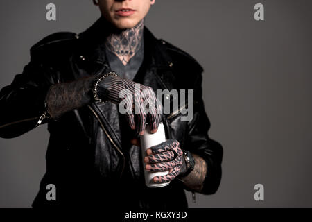 Cropped Shot Of Stylish Man In Leather Jacket Holding Golden