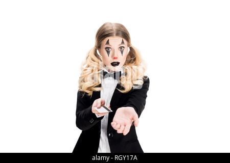 blonde female clown standing in suit and holding credit card isolated on white Stock Photo