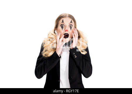 scared female clown standing in suit isolated on white Stock Photo