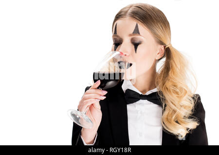 female blonde clown in suit drinking wine isolated on white Stock Photo