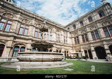 People watching open air live Opera outside the State Opera House in  Karajan Platz Vienna in Austria Stock Photo - Alamy