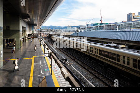 Osaka, Japan - November 21, 2018: Travelers waiting train on platform at Osaka station. Stock Photo