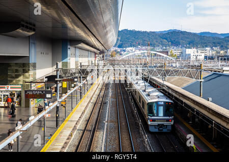 Osaka, Japan - November 21, 2018: Train arriving to platform at Osaka station. Stock Photo