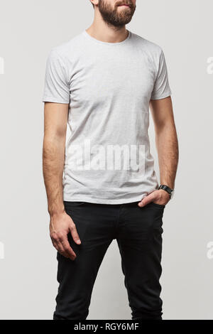 cropped view of man in basic white t-shirt with copy space isolated on white Stock Photo