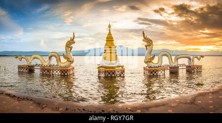 Kwan Phayao, a lake in the province of Phayao, in the North of Thailand, with two white sea snake dragon guardians on the shore Stock Photo